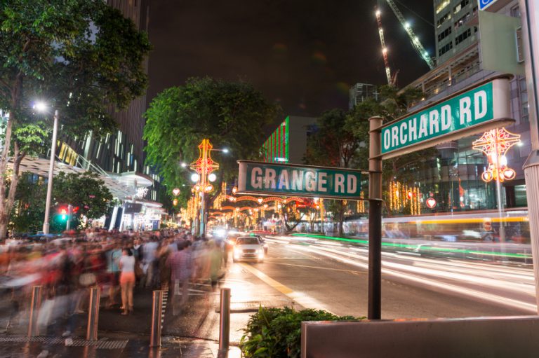 Singapore, Singapore - December 5, 2012: Shoppers, tourists, walking on the pedestrian crossing in the night after a rain, enjoying the view of Christmas light up along Orchard Road. Shopping Centres and the street are light up for Christmas during this festive season.
Orchard Road Christmas Light-up every year, Shopping Centres and Street filled with creative and exuberant facade decor, attracting locals, foreigners and tourists visiting Orchard Road during festival season. The theme of this year Orchard Road Christmas Light-up is "Christmas on a Great Street".