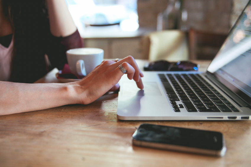 Woman typing on a laptop