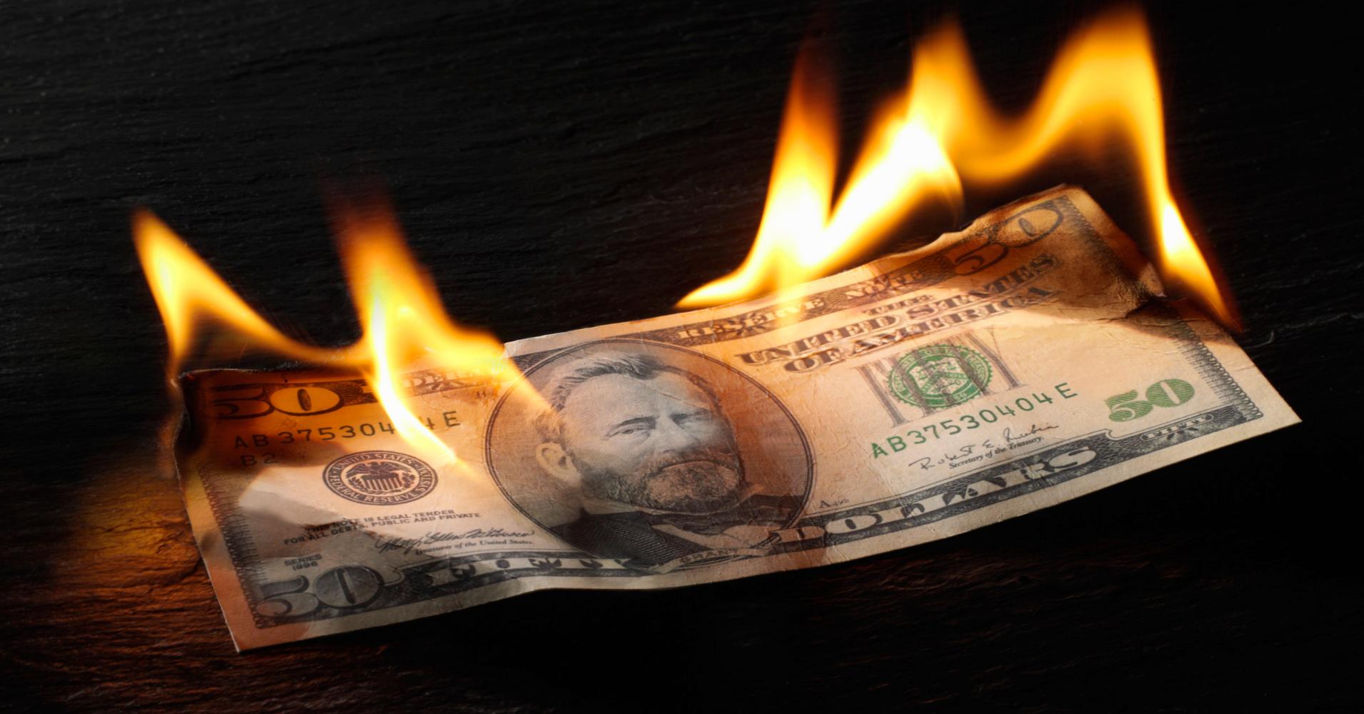 USA US dollar note currency burning