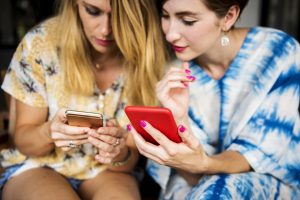ladies chatting and using phones
