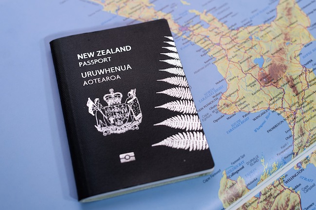 Passport tile New Zealand Passport sitting on a map