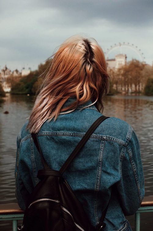 marek-mucha-666300-unsplash-680×1024 Woman with backpack looking over the temps.