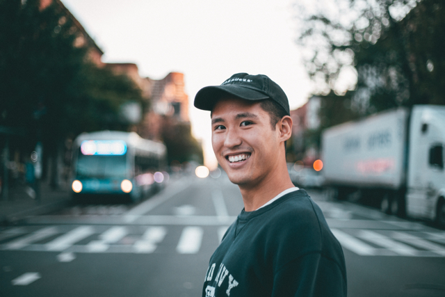 Asian Male Smiling Transfer Large Sums Money Internationally